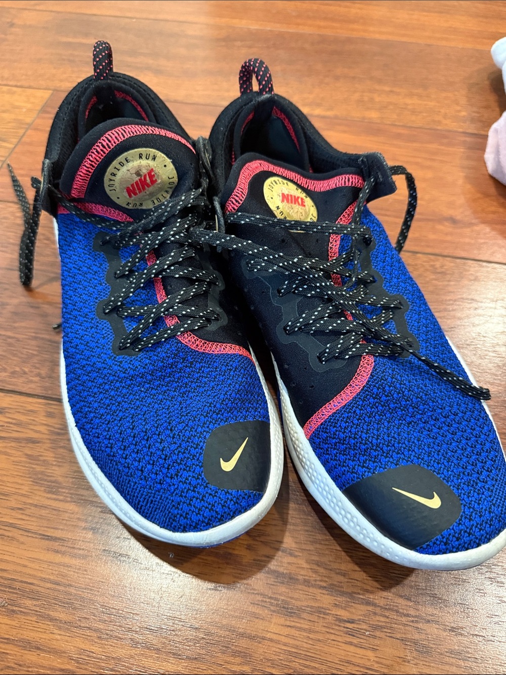 Nike Blue Knit Sneakers with Pink Accents and Gold Logos